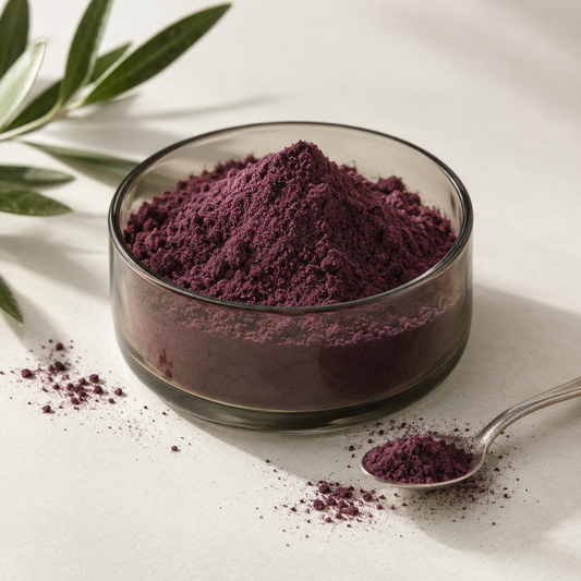 AI-generated ingredient illustration: purple açaí powder in a glass bowl with a spoon. Not a photograph of Navitas packaging or the supplied product.